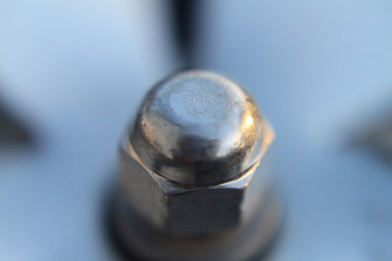 Nut and bolt extreme closeup or macro background image for construction or machinery
