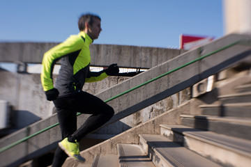 man jogging on steps