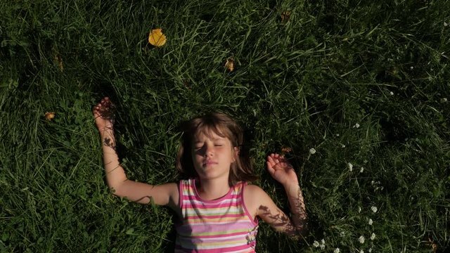 Girl lie down on grass 