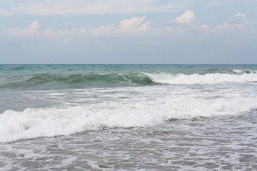Raging waves on the sea in the morning before the storm