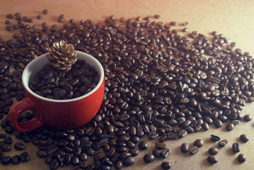 coffee in the cup with pine cone