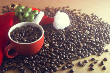 coffee in the cup with xmas tree and santa claus hat