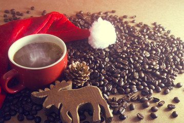 coffee in the cup with pine cone and santa claus hat and deer