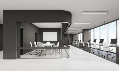 Meeting room with glass wall and row of desktops