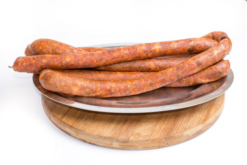 Homemade domestic sausages on white background