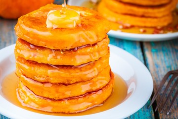 Pumpkin pancakes with honey and butter