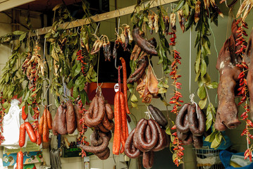 sausages stand inside the historical municipal market of the Bolhao in Oporto, Portugal