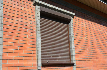 Window with rolling shutter for house protection.