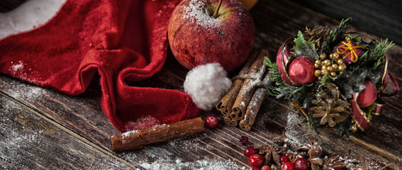 Christmas toys with decoration on dark wooden board
