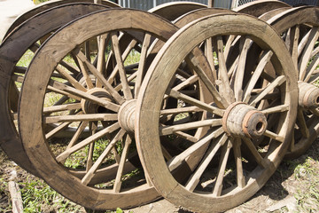 Fototapeta na wymiar pile of antique wooden wheels at Mae Sot, Tak, Thailand