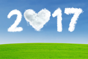 Naklejka premium Cloud shaped of heart with number 2017