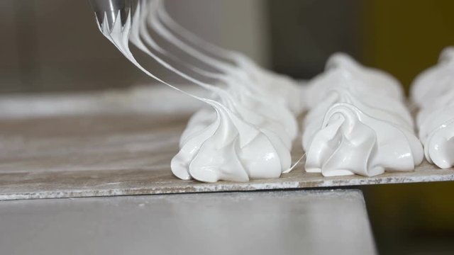 Marshmallow depositing machine making zephyr at confectionery factory