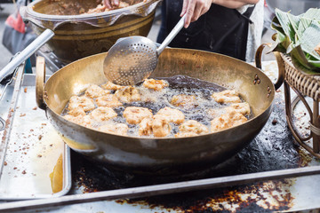 street food in thailand fried fish-paste balls in pan