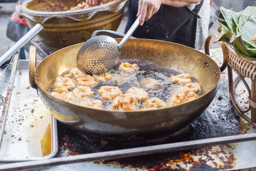 street food in thailand fried fish-paste balls in pan