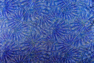 Blue silk fabric background with abstract pattern