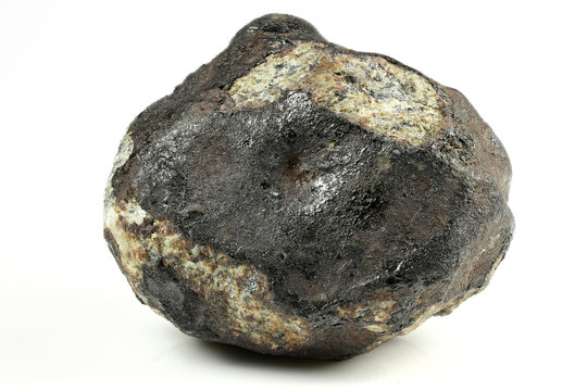 fragment of the Chelyabinsk meteorite (fallen 15 February 2013) isolated on white background