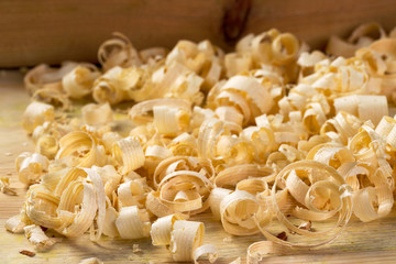 Carpenter tools on wood table background with sawdust. Copy space