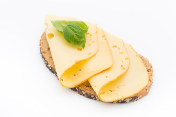 Cheese slices on bread. White background.