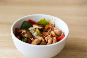 Hot meat salad in white plate