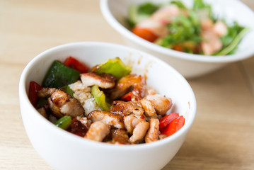 Hot meat salad in white plate