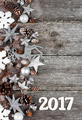 Christmas Decoration Over Wooden Background. Xmas card and gift. Winter holidays theme. Top view. Empty space for text.