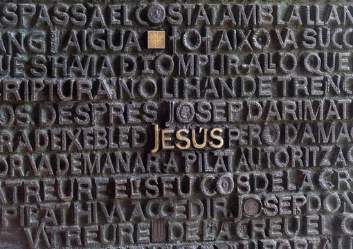 Barcelona, Spain Sagrada Familia door entrance.
Jesus written in golden among other letters on the door entrance obf Sagrada Familia.
