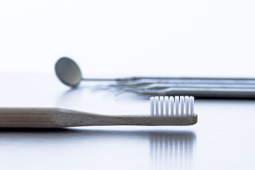 A dentist's tools and a tooth brush