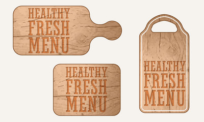 Wooden breadboard with the words healthy fresh menu menu