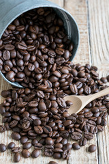 Fototapeta na wymiar coffee beans on wooden table background