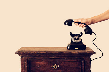 antique telephone receiver in hand held