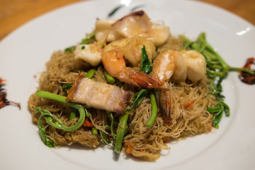 Stir-fried rice vermicelli with water mimosa.