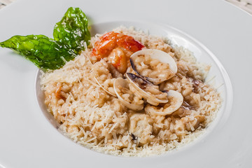 risotto with caramelized spinach and shrimps on a plate