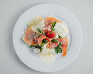 pear and bacon on a white plate. View from above