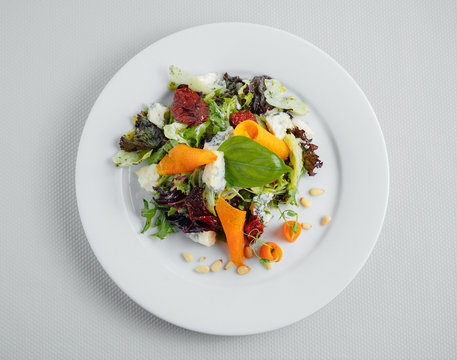 Vegetarian Salad On A White Plate. View From Above