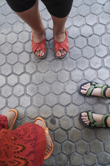 women's feet in sandals