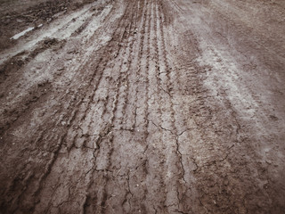 Wheel tracks on the soil.