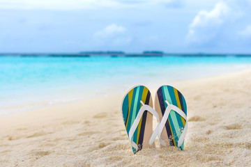 Beach slippers in the sand at Maldives