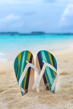 Beach slippers in the sand at Maldives