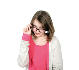 Cute young girl looking over his glasses to view..