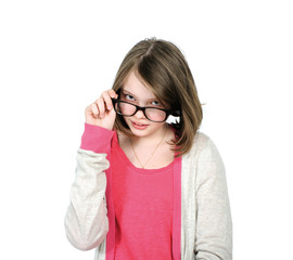 Fototapeta premium Cute young girl looking over his glasses to view..