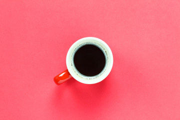 Top view cup of coffee on red background.