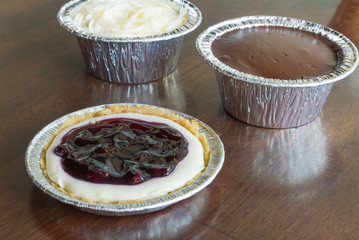 Sweet cupcake on wood background