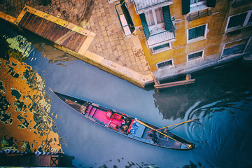 Fototapeta na wymiar Italy - Venice - Gondola in a small canal