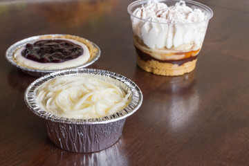 Sweet cupcake on wood background