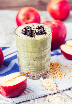 glass of smoothies with spirulina, apple, green buckwheat and be