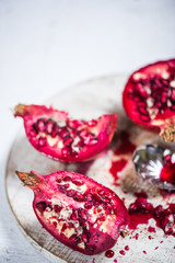 Pomegranate cut on board