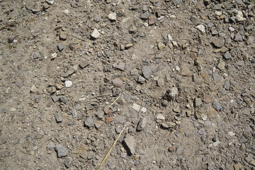 Small stones, gravel, and red dirt