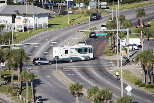 Pensacola Beach Florida USA - October 2016 - Overview Of A RV Towing A Car Over A Road Junction Controlled By A Traffic Light