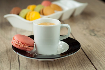 Colorful macaroons over turquoise wood backround