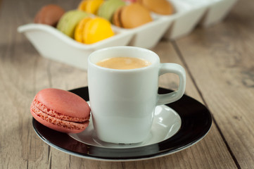 Colorful macaroons over turquoise wood backround